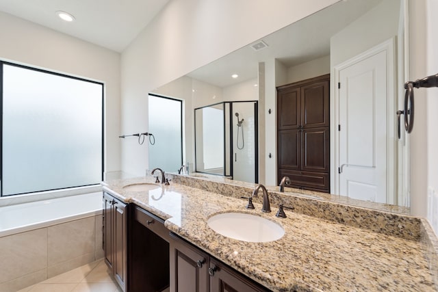 4611 Rose St, Houston, TX 77007 - bathroom with a stall shower, double vanity, tile patterned flooring, and tiled tub