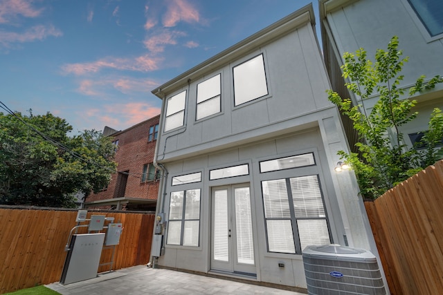 4611 Rose St, Houston, TX 77007 - back of property at dusk with a patio and french doors