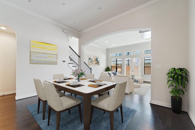4611 Rose St, Houston, TX 77007 - dining room with arched walkways, dark wood-style floors, stairway, crown molding, and recessed lighting
