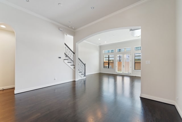 4611 Rose St, Houston, TX 77007 - unfurnished living room with wood finished floors, ornamental molding, stairs, arched walkways, and recessed lighting