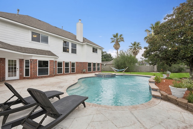 2537 La Rochelle Ct, Seabrook, TX 77586 - view of swimming pool with a patio, a fenced backyard, and a pool with connected hot tub