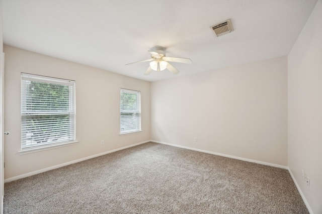 2537 La Rochelle Ct, Seabrook, TX 77586 - carpeted empty room with ceiling fan and baseboards