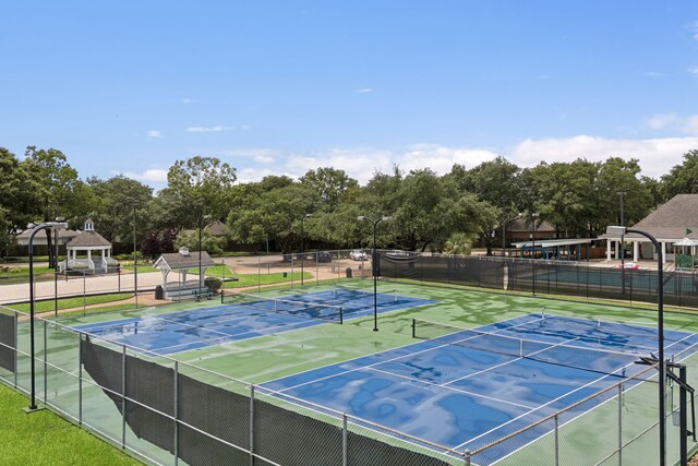 2537 La Rochelle Ct, Seabrook, TX 77586 - view of tennis court with view of wooded area