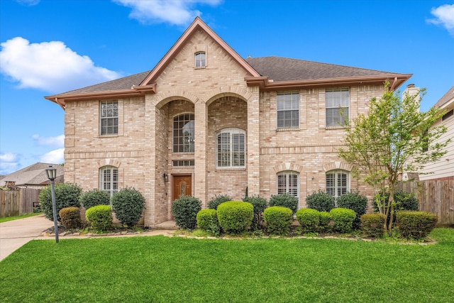 4318 Raintree Ct, Pasadena, TX 77505 - french country inspired facade featuring brick siding and a shingled roof