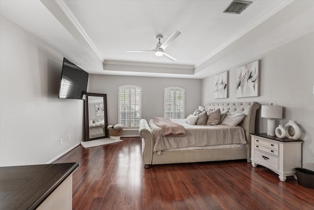 4318 Raintree Ct, Pasadena, TX 77505 - bedroom featuring a tray ceiling, ornamental molding, dark wood-type flooring, and a ceiling fan