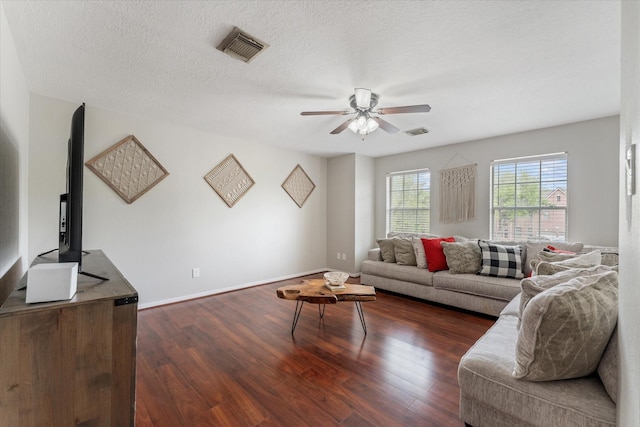 4318 Raintree Ct, Pasadena, TX 77505 - living room with a ceiling fan, dark wood-type flooring, and a textured ceiling