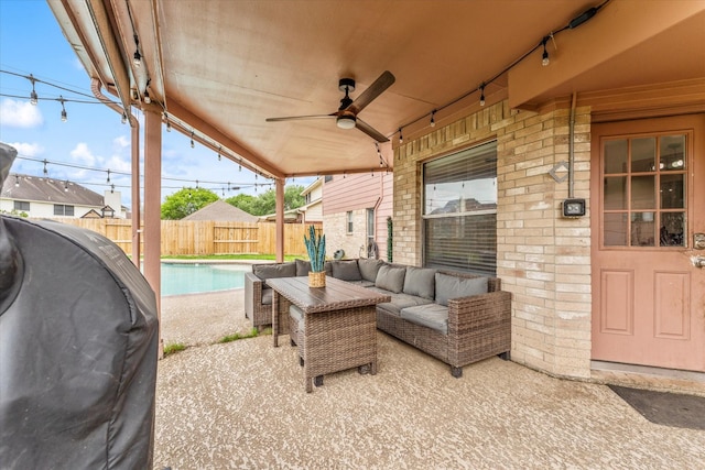 4318 Raintree Ct, Pasadena, TX 77505 - fenced backyard with outdoor lounge area, a ceiling fan, and a patio area