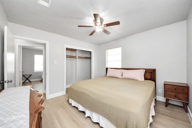 2811 Wentworth Ln, Pasadena, TX 77506 - bedroom with a closet, light wood-style flooring, and ceiling fan