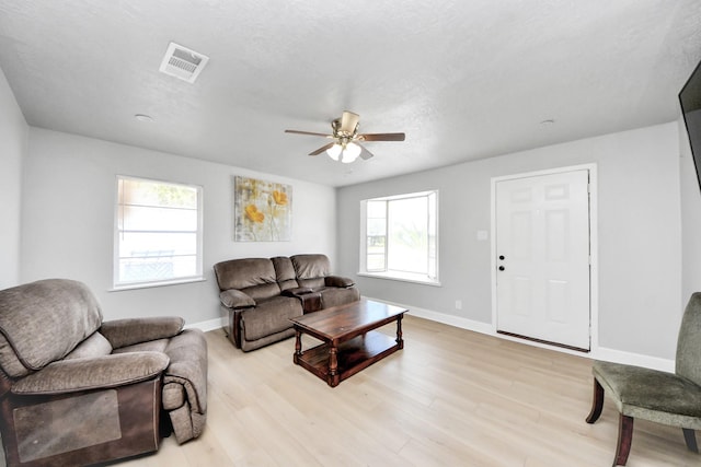2811 Wentworth Ln, Pasadena, TX 77506 - living area with ceiling fan and light wood-style floors
