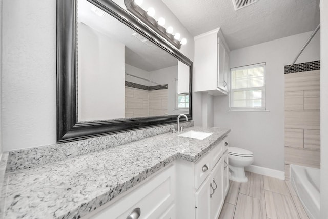 2811 Wentworth Ln, Pasadena, TX 77506 - full bath featuring vanity, bathing tub / shower combination, and a textured ceiling