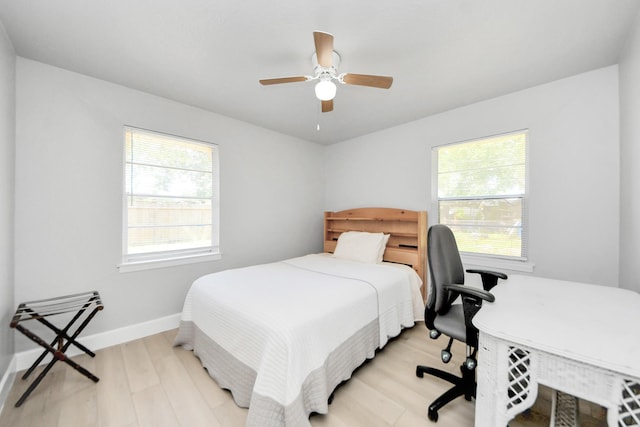 2811 Wentworth Ln, Pasadena, TX 77506 - bedroom with light wood-style floors, a ceiling fan, and an office area