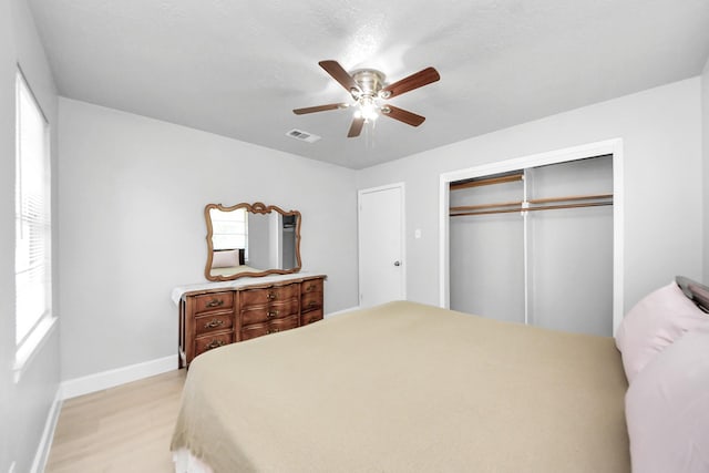 2811 Wentworth Ln, Pasadena, TX 77506 - bedroom featuring a closet, light wood-type flooring, and ceiling fan
