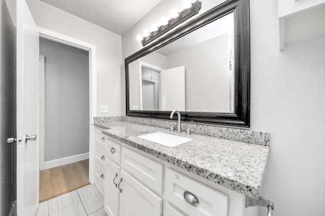 2811 Wentworth Ln, Pasadena, TX 77506 - bathroom with vanity and a textured ceiling