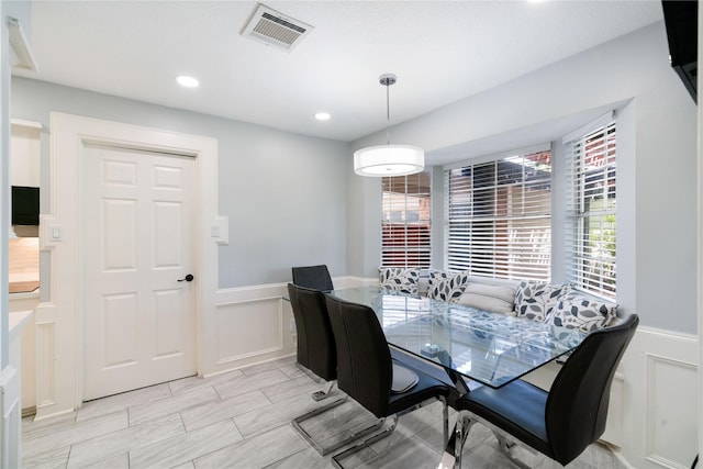 15514 Pebble Bend Dr, Houston, TX 77068 - dining room featuring a decorative wall, wainscoting, and recessed lighting