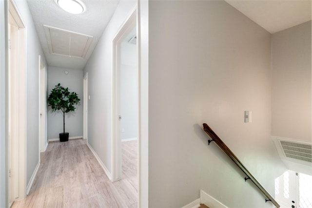 15514 Pebble Bend Dr, Houston, TX 77068 - corridor with an upstairs landing, attic access, and light wood-type flooring