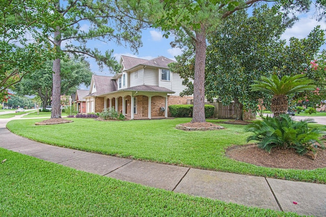 8806 Aberdeen Oaks Dr, Houston, TX 77095 - view of front facade with brick siding, covered porch, and a shingled roof