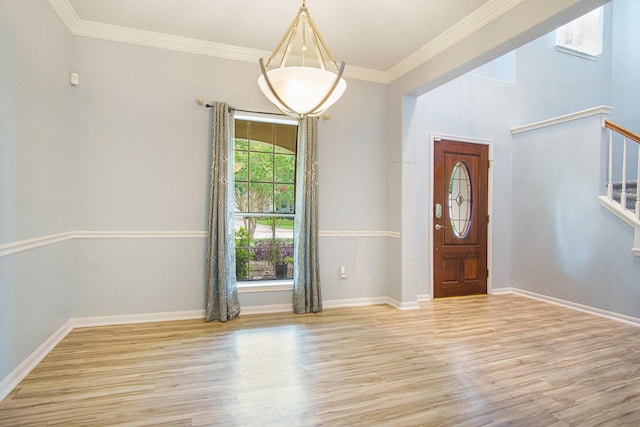 8806 Aberdeen Oaks Dr, Houston, TX 77095 - entryway with light wood-style flooring, stairs, and crown molding