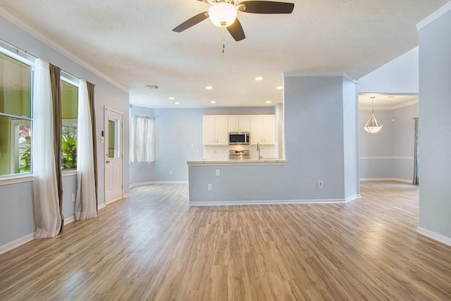 8806 Aberdeen Oaks Dr, Houston, TX 77095 - unfurnished living room with ornamental molding, light wood-style floors, ceiling fan, and recessed lighting
