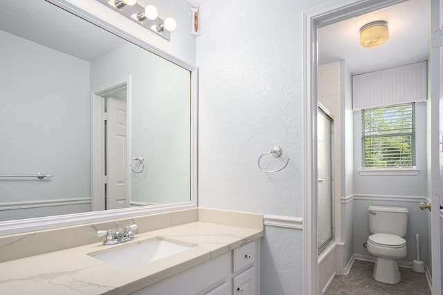 8806 Aberdeen Oaks Dr, Houston, TX 77095 - full bathroom featuring vanity, a textured wall, and enclosed tub / shower combo