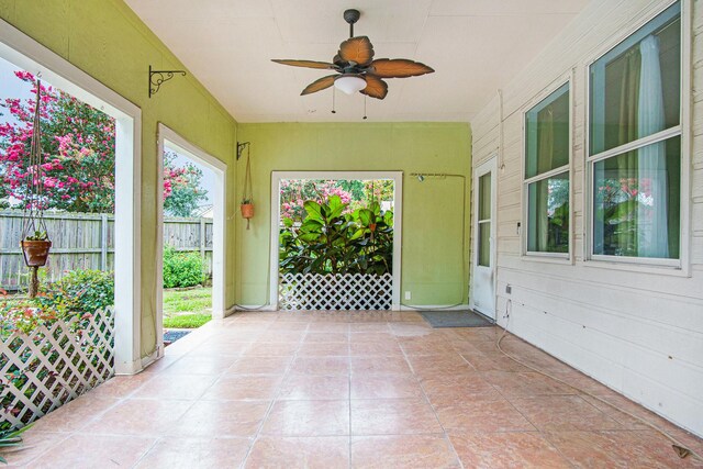 8806 Aberdeen Oaks Dr, Houston, TX 77095 - unfurnished sunroom with ceiling fan and tile patterned floors
