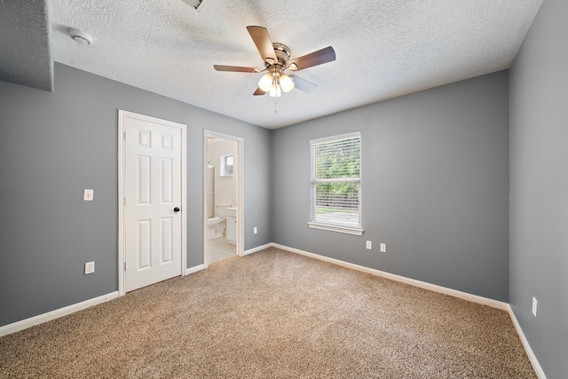 14527 Polo St, Houston, TX 77085 - unfurnished bedroom with carpet floors, ensuite bath, a textured ceiling, and ceiling fan