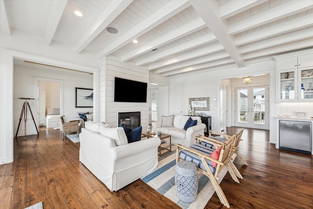 4107 Bluewing Teal Ct, Galveston, TX 77554 - living area featuring dark wood finished floors, a large fireplace, recessed lighting, and beamed ceiling