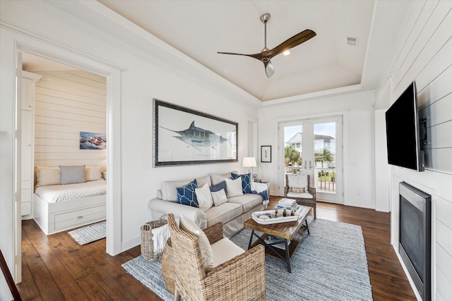4107 Bluewing Teal Ct, Galveston, TX 77554 - living area with a raised ceiling, hardwood / wood-style floors, ceiling fan, and a fireplace
