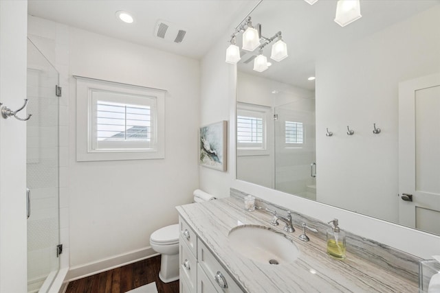 4107 Bluewing Teal Ct, Galveston, TX 77554 - bathroom with vanity, wood finished floors, and a shower stall