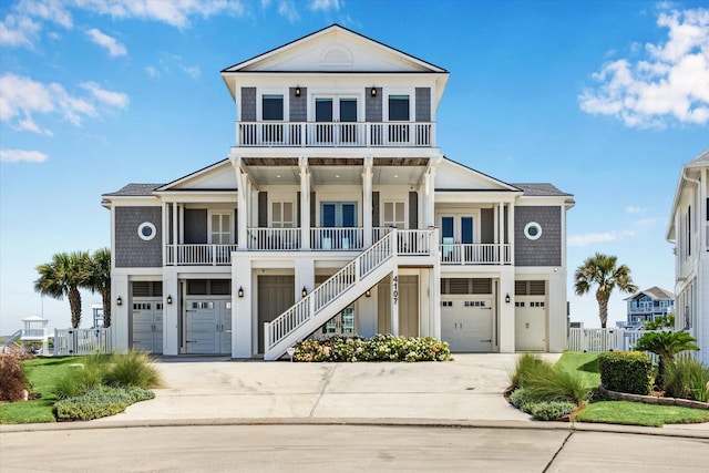 4107 Bluewing Teal Ct, Galveston, TX 77554 - raised beach house with a garage, french doors, and concrete driveway