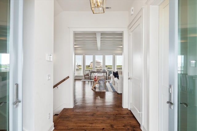 4107 Bluewing Teal Ct, Galveston, TX 77554 - hallway featuring dark wood-type flooring and beamed ceiling