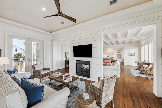 4107 Bluewing Teal Ct, Galveston, TX 77554 - living area with french doors, ceiling fan, dark wood-style floors, a large fireplace, and recessed lighting
