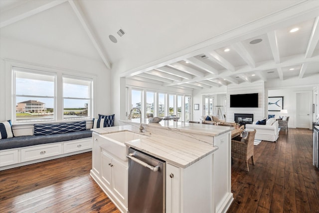 4107 Bluewing Teal Ct, Galveston, TX 77554 - kitchen featuring dishwasher, beamed ceiling, a center island with sink, dark wood-style floors, and recessed lighting