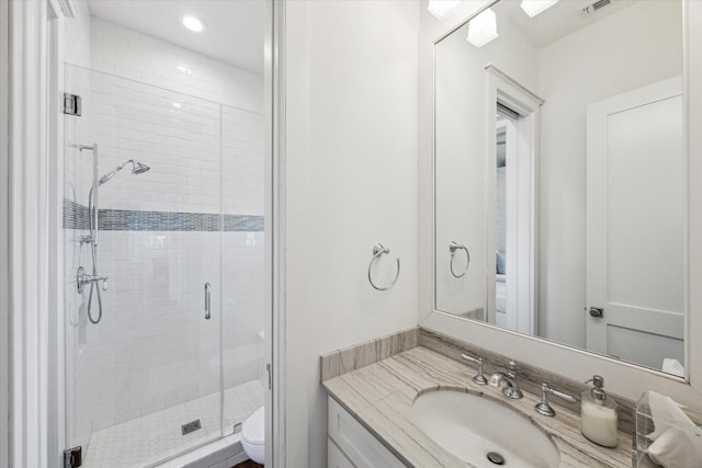 4107 Bluewing Teal Ct, Galveston, TX 77554 - full bathroom with vanity, a shower stall, and recessed lighting