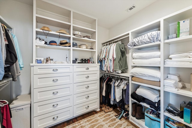 4107 Bluewing Teal Ct, Galveston, TX 77554 - walk in closet featuring wood finished floors
