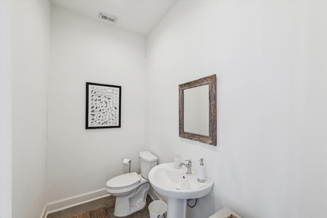 4107 Bluewing Teal Ct, Galveston, TX 77554 - half bathroom featuring baseboards and toilet