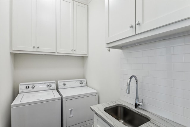 4107 Bluewing Teal Ct, Galveston, TX 77554 - laundry area with cabinet space and washing machine and dryer