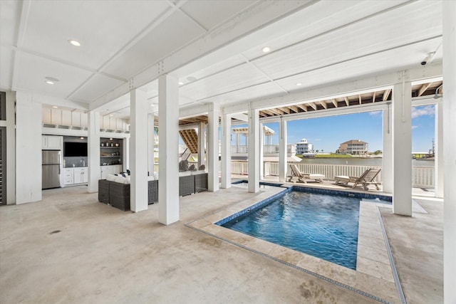 4107 Bluewing Teal Ct, Galveston, TX 77554 - swimming pool featuring a patio area, a water view, and outdoor lounge area