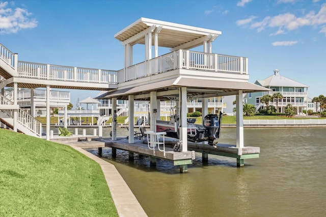 4107 Bluewing Teal Ct, Galveston, TX 77554 - dock area featuring a water view, boat lift, and a lawn