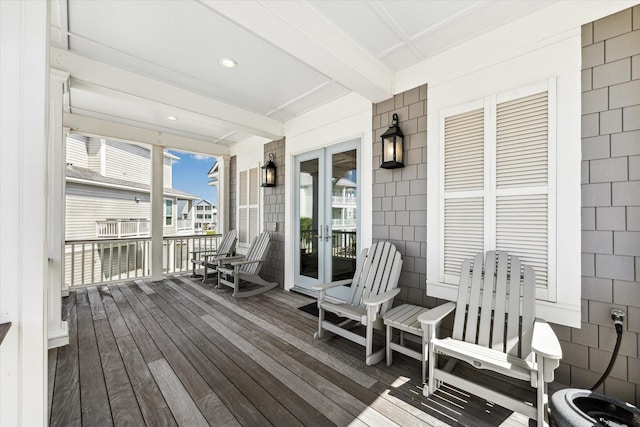 4107 Bluewing Teal Ct, Galveston, TX 77554 - wooden porch with french doors