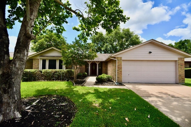 18723 Clover Gln, Katy, TX 77084 - ranch-style house featuring brick siding, an attached garage, concrete driveway, and a front yard
