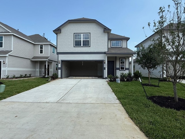 2572 Hawks Eye Dr, Conroe, TX 77301 - traditional-style house featuring a front lawn, concrete driveway, and a garage