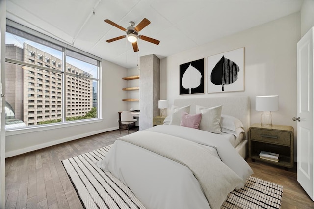1901 Post Oak Blvd Unit 609, Houston, TX 77056 - bedroom featuring wood finished floors and ceiling fan