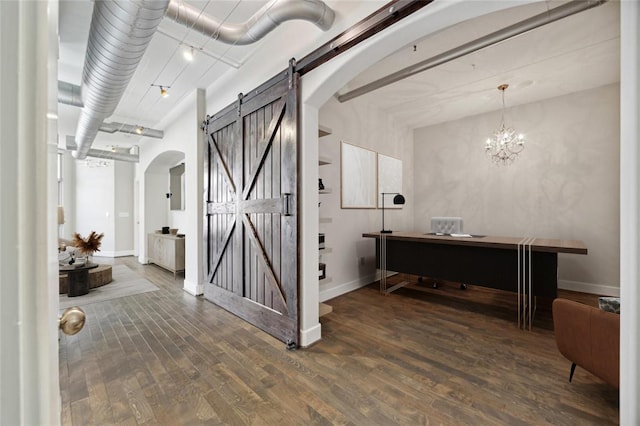 1901 Post Oak Blvd Unit 609, Houston, TX 77056 - foyer entrance with a barn door, arched walkways, wood finished floors, and a chandelier