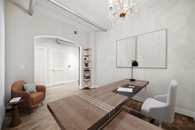 1901 Post Oak Blvd Unit 609, Houston, TX 77056 - office space with arched walkways, wood finished floors, and a chandelier