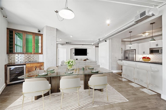 1901 Post Oak Blvd Unit 609, Houston, TX 77056 - dining area with beverage cooler and wood finished floors