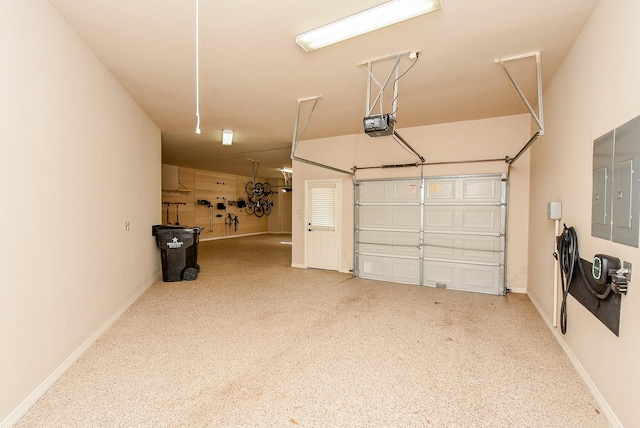 42 Lake Sterling Gate Dr, Spring, TX 77379 - garage with baseboards and a garage door opener