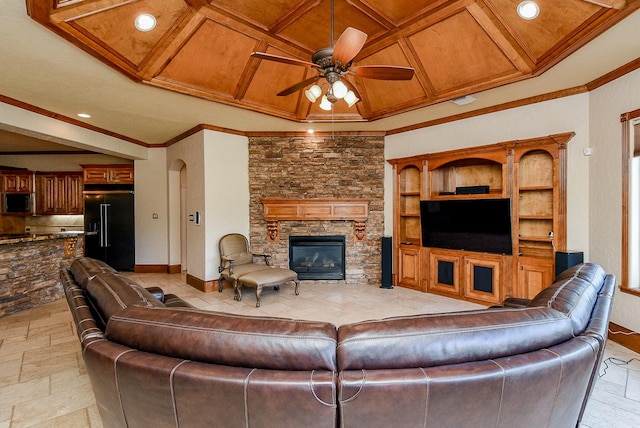 42 Lake Sterling Gate Dr, Spring, TX 77379 - living room featuring a ceiling fan, a fireplace, stone tile flooring, ornamental molding, and recessed lighting