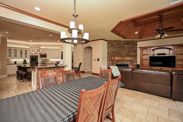42 Lake Sterling Gate Dr, Spring, TX 77379 - dining area featuring ornamental molding, a chandelier, ceiling fan, recessed lighting, and stone tile floors