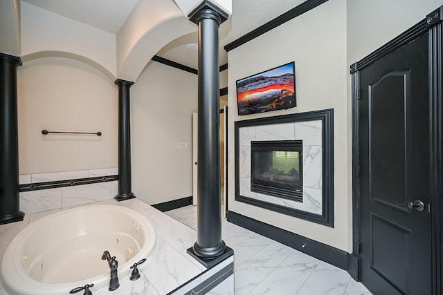 42 Lake Sterling Gate Dr, Spring, TX 77379 - full bath with a jetted tub, marble look tile flooring, a fireplace, and ornate columns