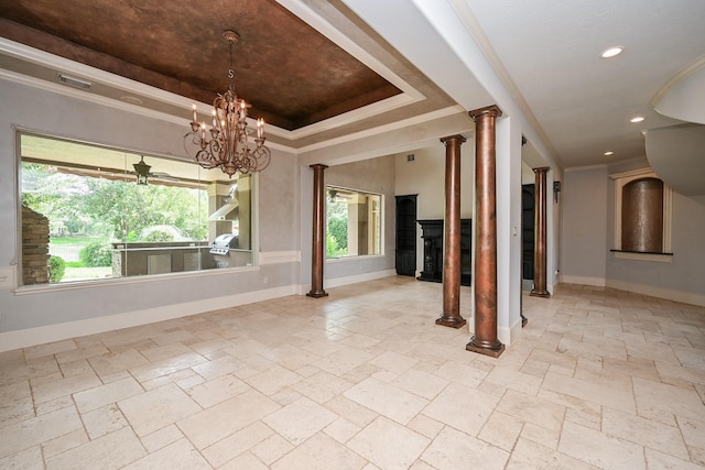 42 Lake Sterling Gate Dr, Spring, TX 77379 - spare room with stone tile floors, ornamental molding, a tray ceiling, recessed lighting, and ornate columns